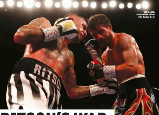  ?? Photos: ACTION IMAGES/LEE SMITH ?? GRUELLING: Ritson sinks a blow into Davies’ body