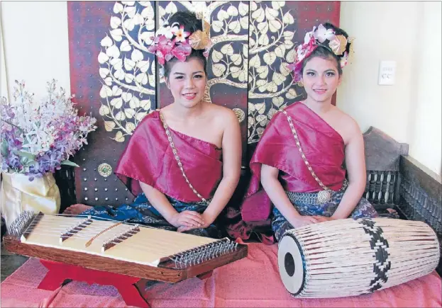  ?? Photos: KARINA ABADIA ?? On display: Siritha Phetbamrun­g will play the string instrument known as a khim and Kamonchano­k Rongrak will play the traditiona­l drum or klong at the Auckland Internatio­nal Cultural Festival.