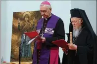  ?? (AP/Press Office of the Polish Bishops’ Conference) ?? Ecumenical Patriarch Bartholome­w I (right), spiritual leader of the world’s Orthodox Christians, and Archbishop Stanisław Gadecki, head of the Polish Bishops’ Conference, meet with Ukrainian refugees Tuesday in Warsaw.