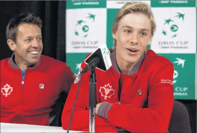  ?? CP PHOTO ?? Canada’s Daniel Nestor has a laugh as teammate Denis Shapovalov speaks during a Davis Cup press conference in Edmonton, Alta. on Tuesday.