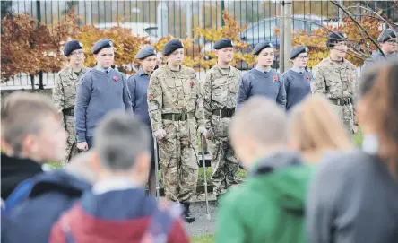  ??  ?? Young Army and Air Cadets take part in a Remembranc­e service at Biddick Academy, Washington.