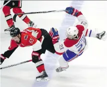  ?? JUSTIN TANG/THE CANADIAN PRESS ?? Ottawa Senators’ Erik Karlsson collides with Canadiens’ Stefan Matteau at the blue line in Saturday’s game. Three Canadien power plays ended in disaster with the Senators scoring in each.