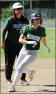  ?? MIKE BUSH/NEWS SENTINEL ?? Liberty Ranch baserunner Rachael Atkins rounds third base in front of Hawks coach Shauna DalBianco earlier this spring. Atkins was named to the SVC AllLeague first team, while DalBianco was named the league’s coach of the year.