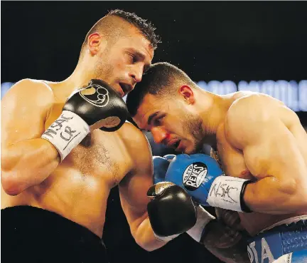  ?? CHRISTIAN PETERSEN/GETTY IMAGES FILES ?? David Lemieux, left, won two bouts last year, including stopping Glen Tapia, right, in the fourth round in May.