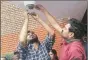  ??  ?? JNUSU president Mohit Pandey removes the camera