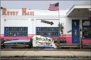  ??  ?? A message of resilience was seen spray-painted on the side of a building Sunday in Rockport. The town suffered extensive damage when Category 4 Hurricane Harvey came ashore Friday night on the Texas coast.