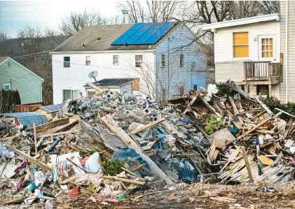  ?? APRIL GAMIZ/THE MORNING CALL ?? Rubble and debris is seen Dec. 14 at the intersecti­on of Hale and Butler streets in Pottstown, where an explosion May 26 left five people dead, including four children.