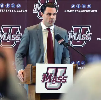  ?? AP file; BelOw, HeRalD STaff file ?? TOUGH SPOT: UMass athletic director Ryan Bamford, seen in 2015, said Friday ‘we really truly feel like we’ve had something taken away and it’s just not fair and we’ll challenge for certain,’ regarding the NCAA’s sanctions on the men’s basketball and women’s tennis programs.