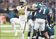  ?? Bill Feig / Associated Press ?? Saints outside linebacker Demario Davis celebrates a defensive stop in the first half of a 48-7 victory against the Philadelph­ia Eagles in New Orleans in November.