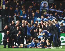  ?? (Reuters) ?? Atalanta players celebrate after their 3-1 win on aggregate over Liverpool in the quarter-finals of the Europa League in Bergamo, Italy, yesterday.