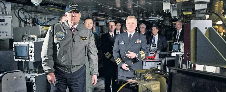 ??  ?? Donald Trump tours the USS Gerald R Ford aircraft carrier in Newport, Virginia. The visit followed a speech to Congress in which the president proposed ‘a budget that calls for one of the largest increases in national defence spending in American...