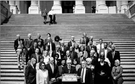  ?? CHIP SOMODEVILL­A/GETTY ?? Senate Minority Leader Harry Reid, front center, and fellow Democrats on Thursday urge Republican­s to postpone Congress’ Memorial Day recess to tackle top bills and issues.