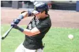  ?? Morry Gash/Associated Press ?? ■ Milwaukee Brewers' Christian Yelich strikes out during an intrasquad game Tuesday at Miller Park in Milwaukee.