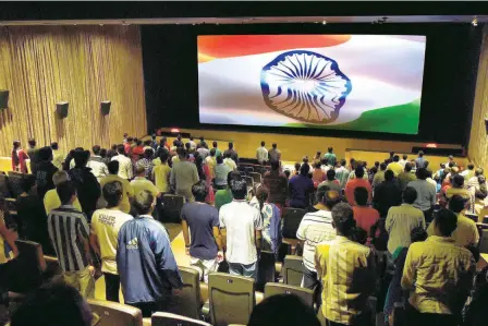  ??  ?? THE NATIONAL ANTHEM being played before the start of a film at a cinema in Chennai. In 2016, the Supreme Court directed that all cinema halls shall play the national anthem before a feature film starts and all present in the hall are obliged to stand up.
