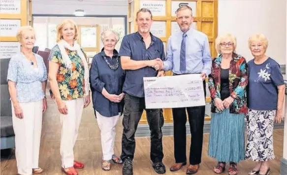  ??  ?? At Ty Bryngwyn Hospice on July 10 Keith Every, brother of Gina Hughes, presented a cheque for £1,081.50 to David Craddock, chairman of the Hospice Committee. Mr Every organised a very successful fundraisin­g evening at the Burry Port Legion on June 28 which attracted a great deal of support from family and friends.