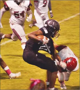  ?? Gretchen McCurry/Special to the News-Times ?? Room to move: Smackover’s D'Kylan Hildreth looks for running room during a game this past season. Hildreth was recently visited by national football recruiting analyst Tom Lemming.