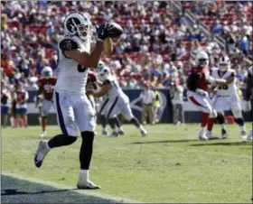  ?? MARCIO JOSE SANCHEZ — THE ASSOCIATED PRESS ?? Los Angeles Rams tight end Tyler Higbee secures against the Arizona Cardinals during the second half of an NFL football game Sunday in Los Angeles.
