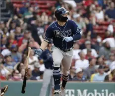  ?? Associated Press ?? Tampa Bay Rays’ Austin Meadows drops his bat as he watches his game-tying inside-the-park home run against the Boston Red Sox during the ninth inning Monday at Fenway Park in Boston.