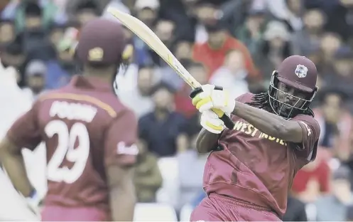  ??  ?? 0 Chris Gayle hits out on his way to a 34- ball 50 as West Indies thrashed Pakistan by seven wickets at Trent Bridge yesterday.