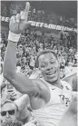  ?? Reinhold Matay / Associated Press ?? Central Florida guard Matt Williams basks in the glow of Sunday’s upset victory over No. 15 Cincinnati.