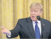  ??  ?? WEARY OF DANGERS: President Donald Trump delivers remarks in the White House on Friday.