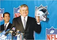  ?? MARK ELIAS AP ?? Jerry Richardson shows off his new team’s helmet as Carolina Panthers became the newest NFL franchise in 1993.