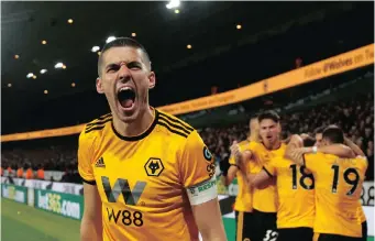  ?? REUTERS ?? CONOR COADY celebrates after Diogo Jota scores Wolves’ second goal against Manchester United in the FA Cup on Saturday. | CARL RECINE