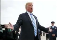  ?? THE ASSOCIATED PRESS ?? President Donald Trump speaks to the media as he steps off Air Force One on Tuesday in Charleston, W.Va.