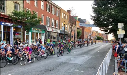  ?? SUBMITTED PHOTO ?? Racers in the Benchmark Criterion Twilight Classic whiz along the streets of West Chester on Saturday.