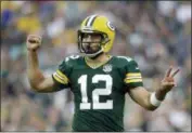  ?? JEFFREY PHELPS — THE ASSOCIATED PRESS FILE ?? Green Bay Packers quarterbac­k Aaron Rodgers gestures during a preseason game against the Pittsburgh Steelers earlier this month. The Packers just need to keep Rodgers upright and healthy for a full season again. A glimpse at what life is like without him showed just how precious these windows of opportunit­y can be with a two-time NFL MVP at quarterbac­k. Rodgers and the Packers agreed to terms on a four-year, $134 million extension on Wednesday.