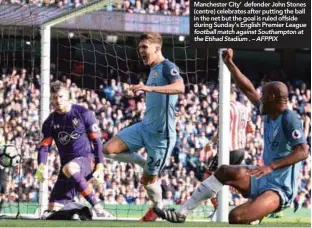  ??  ?? Manchester City’ defender John Stones (centre) celebrates after putting the ball in the net but the goal is ruled offside during Sunday’s English Premier League football match against Southampto­n at the Etihad Stadium . – AFPPIX