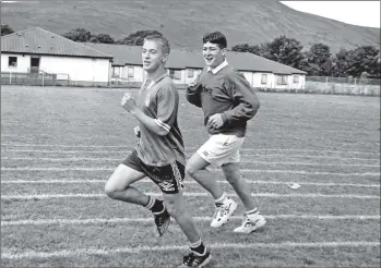  ?? B25twe02 ?? Darren Thompson and David Hamilton race in the 800 metres at the Arran High School Sports Day last Monday where Sannox House were crowned champions for the fourth year in a row.