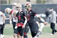  ?? AP Photo/ Jeff Chiu ?? ■ San Francisco 49ers quarterbac­k Jimmy Garoppolo (10) stretches during practice at the team’s facility Thursday in Santa Clara, Calif.