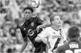  ?? JOHN RAOUX/ASSOCIATED PRESS ?? Orlando City’s Cristian Higuita, left, trained to make sure he would be a good fit in coach Jason Kreis’ new system. Higuita’s offseason work helped him earn time on the field.