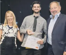  ??  ?? Rory with his award, pictured with Sue Sheath, Director of care, risk and compliance. and Barchester CEO Dr Pete Calveley