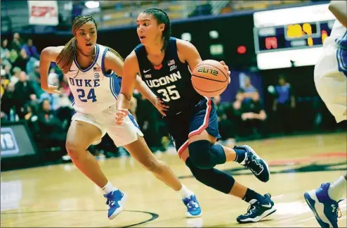  ?? Rick Bowmer / Associated Press ?? UConn’s Azzi Fudd, right, drives to the basket against Duke earlier this season.