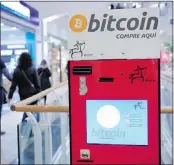  ?? — GETTY IMAGES FILES ?? U.S. officials are said to be looking into the closing of Mt. Gox, the major exchange for bitcoins, which were available from special bitcoin ATMs like this one in Barcelona.