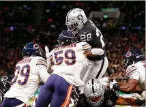  ?? JACK THOMAS / GETTY IMAGES ?? Raiders rookie running back Josh Jacobs (28), a first-round pick in April, leaps into the end zone for the go-ahead touchdown against the Bears in the fourth quarter Sunday at Tottenham Hotspur Stadium in London.