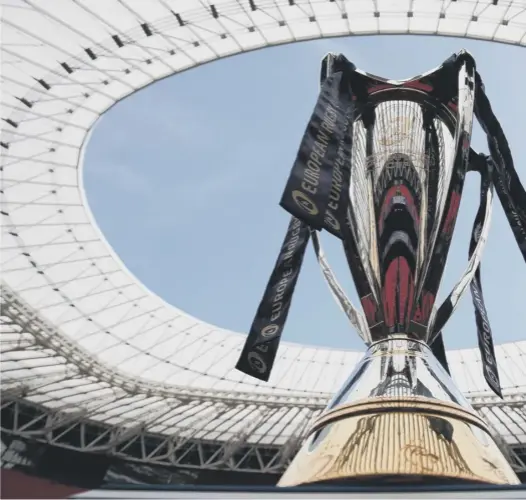  ??  ?? The Champions Cup on display during yesterday’s captain’s run at the San Mames Stadium in Bilbao, where Leinster and Racing 92 will