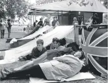  ??  ?? 0 On this day in 1993, people queued overnight to be first in line as Buckingham Palace was opened to the public