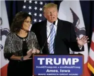  ?? MARK KAUZLARICH/REUTERS ?? Even U.S. Republican presidenti­al candidate Donald Trump seemed uncomforta­ble at times during Sarah Palin’s endorsemen­t speech in Iowa on Tuesday, Vinay Menon writes.