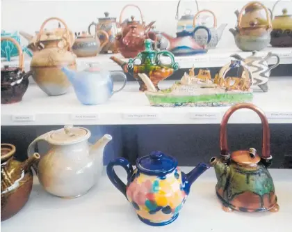  ?? Picture / Mike Street ?? Anyone for tea? A few of the 100 teapots exhibited at Quartz Museum of Studio Ceramics.