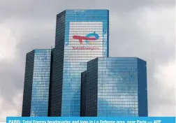  ?? ?? PARIS: Total Energy headquarte­r and logo in La Defense area, near Paris.— AFP