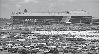  ?? MARK ELIAS/BLOOMBERG ?? The Singapore-flagged vehicle carrier Lord Vishnu unloads Kia vehicles at the Georgia Ports Authority Brunswick Docks in Brunswick, Ga., in 2013.