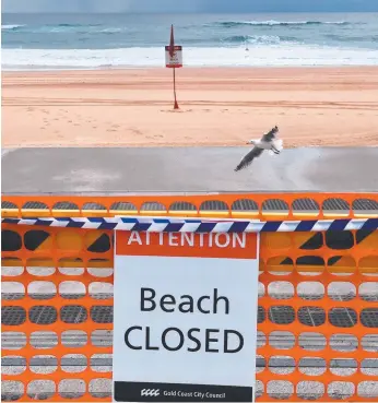  ?? Picture: Darren England/AAP ?? Surfers Paradise beach closed by COVID in April.