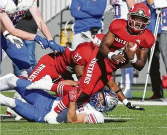  ??  ?? North Shore quarterbac­k Dematrius Davis is sacked by AustinWest­lake defensive back Jax Crockett during the second quarter. Davis was sacked five times and threw two intercepti­ons.