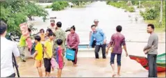  ?? SUPPLIED ?? Authoritie­s employ a boat to evacuate residents of a flooded village in Ratanakkir­i province.