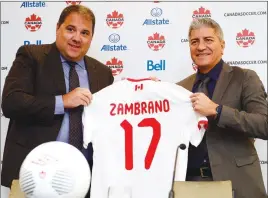  ?? CP PHOTO ?? Canada Soccer president Victor Montaglian­i, left, introduces new head coach of the men’s national team Octavio Zambrano at a news conference in Toronto.