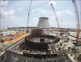  ?? JOHN BAZEMORE — THE ASSOCIATED PRESS ?? FILE- This June 13, 2014, file photo, shows constructi­on on a new nuclear reactor at Plant Vogtle power plant in Waynesboro, Ga. A group of Georgia lawmakers wants a “cost cap” in the constructi­on of a nuclear power plant near Augusta to protect blown budgets from being passed on to consumers. Two reactors being built at Plant Vogtle are billions of dollars over budget.