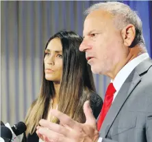  ??  ?? Actor Dominique Huett and attorney Jeff Herman announce a negligence lawsuit against the Weinstein Company at a news conference in Los Angeles on Wednesday.